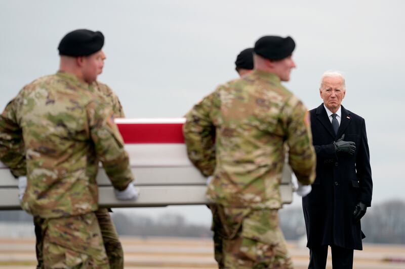 President Joe Biden joined grieving families to watch as the remains of three army reserve soldiers were returned to the US at Dover Air Force Base (Matt Rourke/AP)