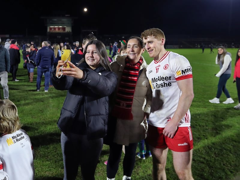 Supporters on the pitch for pictures and autographs wity players including Peter Harte, after watching Tyrone beat Mayo during the National League Division 1 match played at Healy Park in Omagh on Saturday 24th February 2024. Picture Margaret McLaughlin