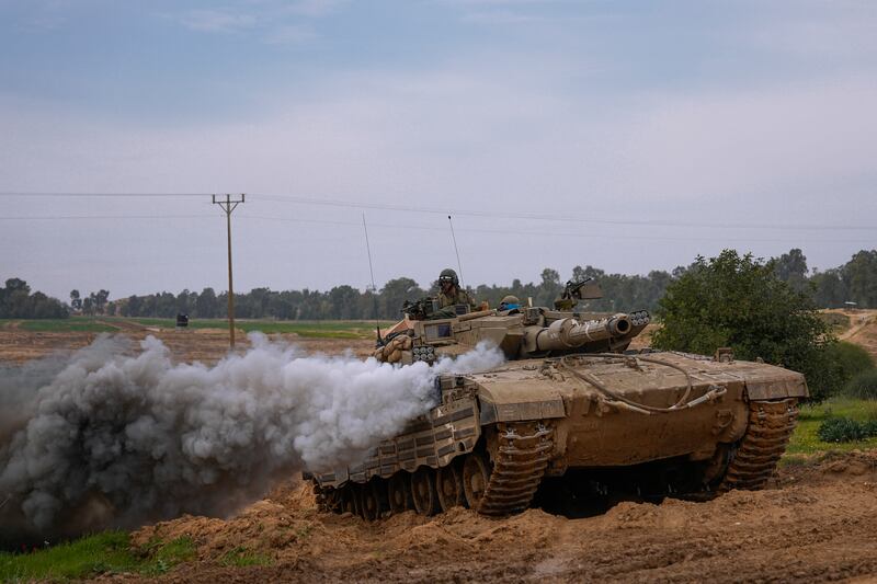 An Israeli tank near the Gaza border (Ohad Zwigenberg/AP)