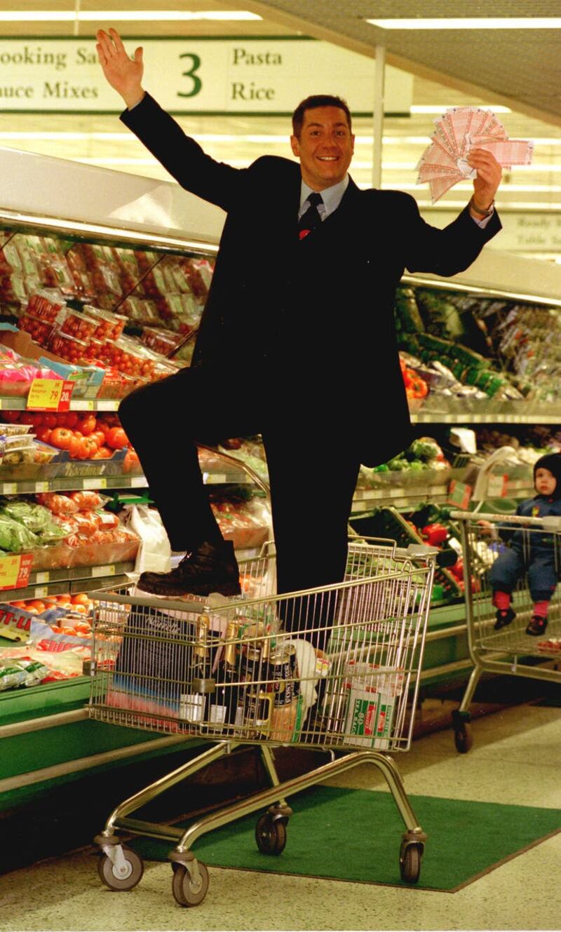 Dale Winton doing a ‘Supermarket Sweep’ in Brent Cross, London, to promote the midweek National Lottery. The presenter has died at the age of 62, his agent has said (Tony Harris/PA)