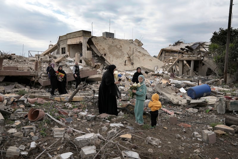 Lebanese citizens check the destruction in the border village of Aita al-Shaab (Bilal Hussein/AP)