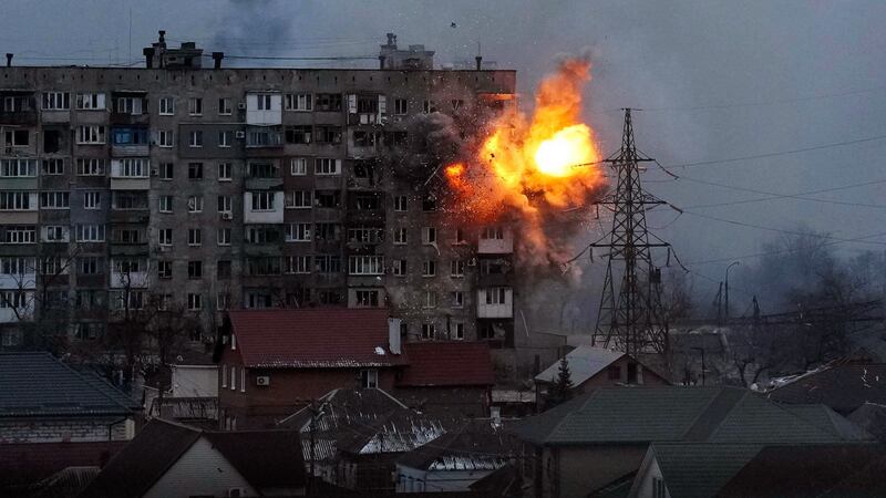 An explosion in a Mariupol apartment block after a Russian tank fires a shell