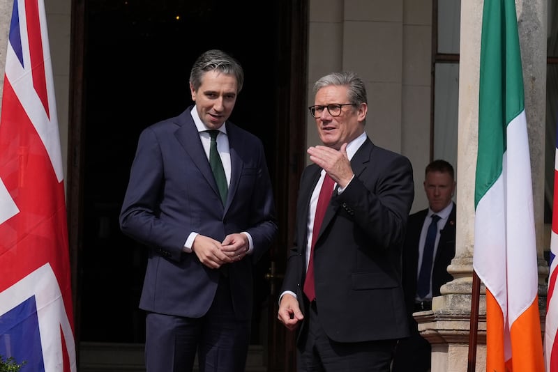 Taoiseach Simon Harris greets Prime Minister Sir Keir Starmer outside Farmleigh House