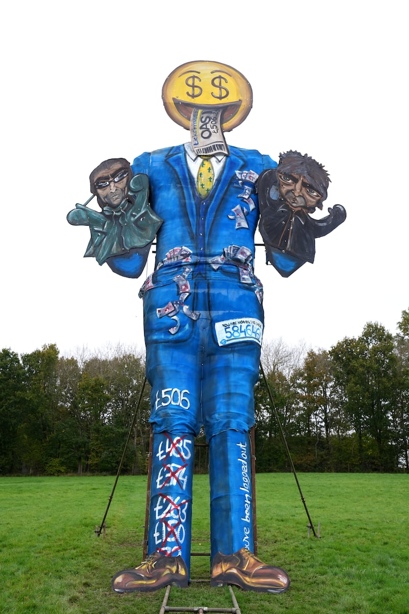 Members of the Edenbridge Bonfire Society unveil their guy for 2024 at Breezehurst Farm Industrial Park, Edenbridge, Kent, ahead of the town’s Bonfire Night