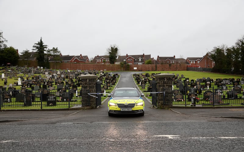 Police seal of the cemetery nearby as Police are investigating the sudden death of a woman at a property in the Laurel Heights area of Banbridge. PICTURE COLM LENAGHAN