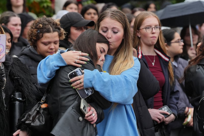 People attend a London vigil for Liam Payne, who rose to fame with the boy band on The X Factor