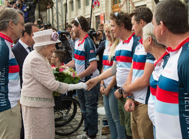 The late Queen Elizabeth II meeting Josh Boggi in connection with the Help for Heroes charity’s Big Battlefield Bike Ride in Paris in 2014