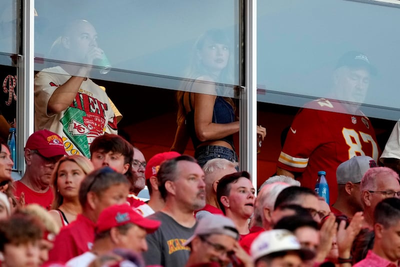 Taylor Swift is seen in a suite before the start of an NFL football game between the Kansas City Chiefs and the Baltimore Ravens (AP Photo/Ed Zurga)