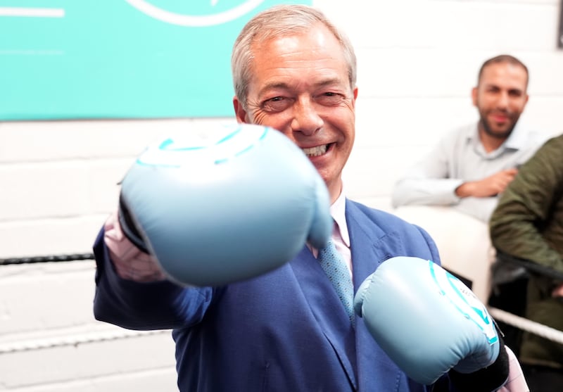 Reform UK leader Nigel Farage wearing boxing gloves at a gym in Clacton
