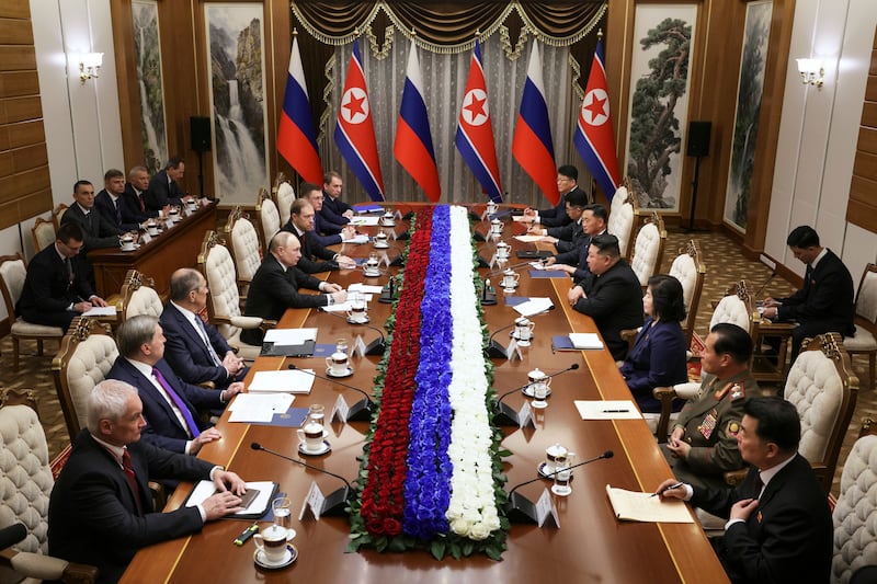 Mr Putin was joined by senior ministers at the visit (Sputnik, Kremlin Pool Photo via AP)