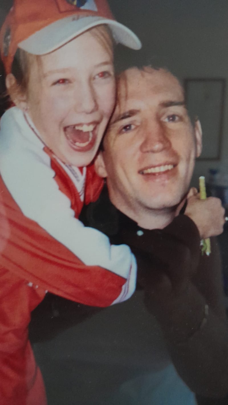 Janet Small hugging a young Kieran McGeeney, both smiling