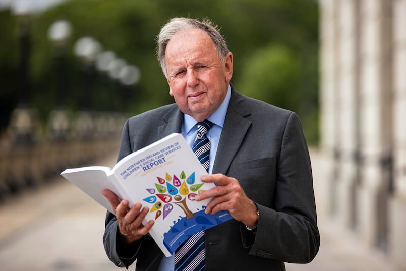 Professor Ray Jones with the Northern Ireland review of children's social care services report at Stormont last June. PICTURE: LIAM MCBURNEY/PA WIRE