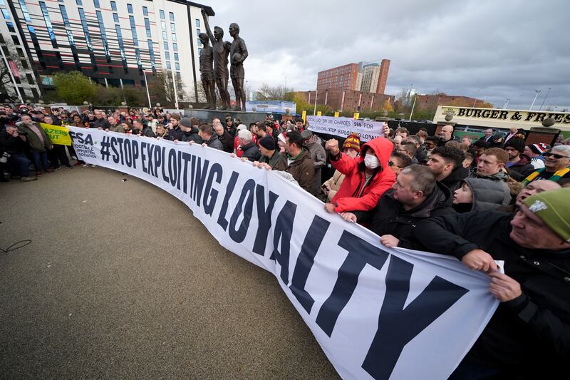 Manchester United fans protest against ticket pricing ahead of the game