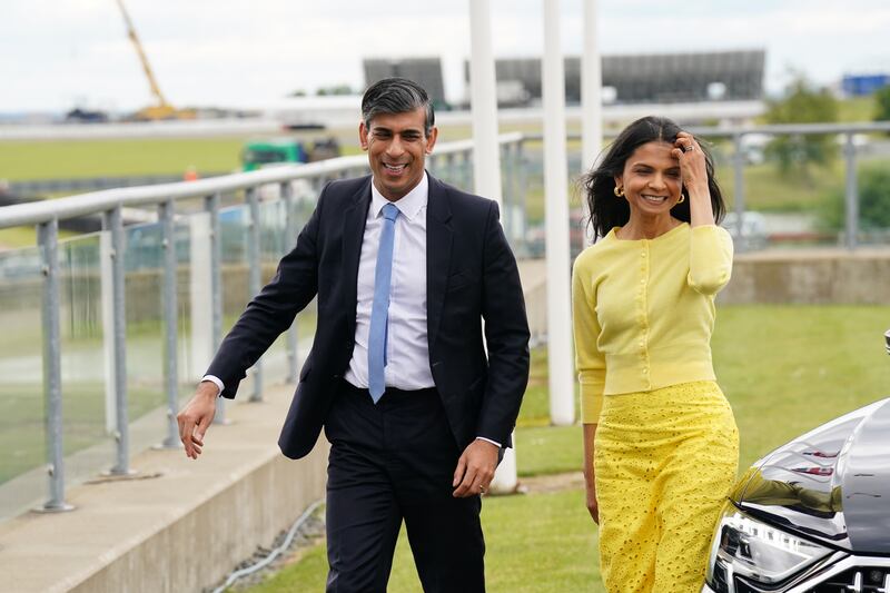 Rishi Sunak and wife Akshata Murty arrive for the launch of the Conservative Party General Election manifesto at Silverstone in Towcester, Northamptonshire