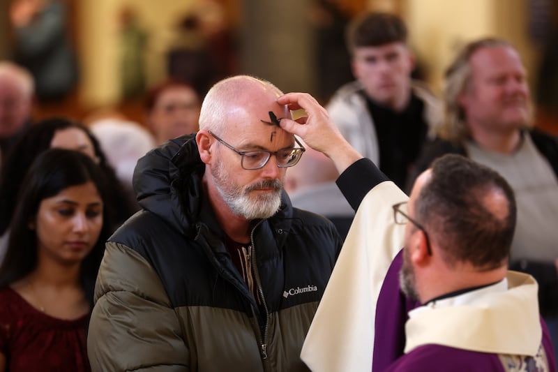 Parishioners young and old receive their ashes from Fr Tony and Fr Eugene at St Patricks Church in Donegall Street, Belfast marking the beginning of Lent