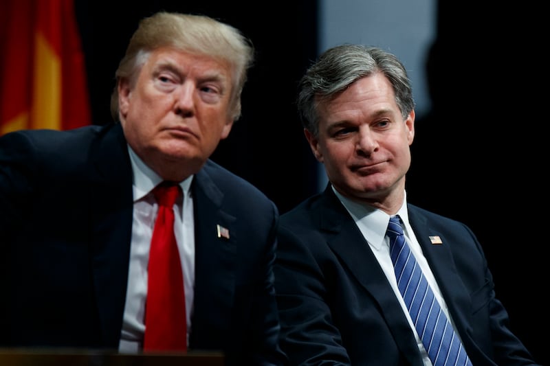 The-president Donald Trump with Christopher Wray during the FBI National Academy graduation ceremony in 2017, in Quantico, Virginia (Evan Vucci/AP)