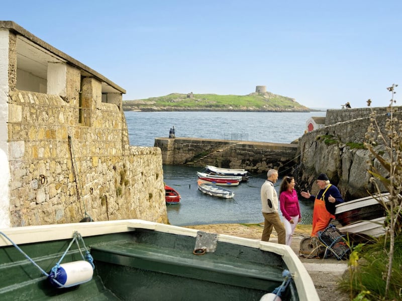 Colliemore Harbour, with the Martello tower on Dalkey Island in the distance. 