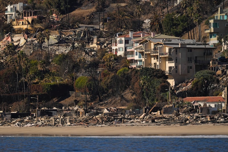 A coastline view shows properties damaged by the Palisades Fire (Carolyn Kaster/AP)