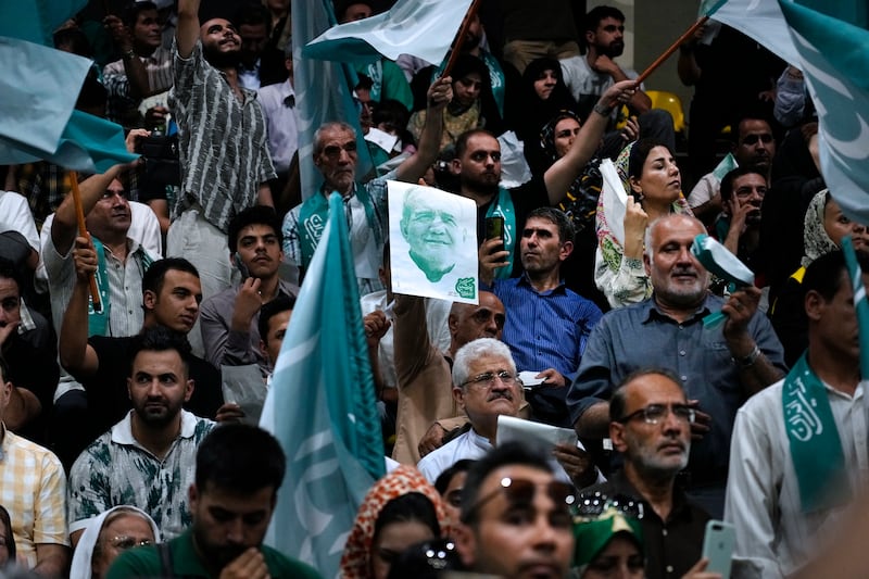 Supporters of Masoud Pezeshkian attended a campaign meeting in Tehran ahead of the election (Vahid Salemi/AP)