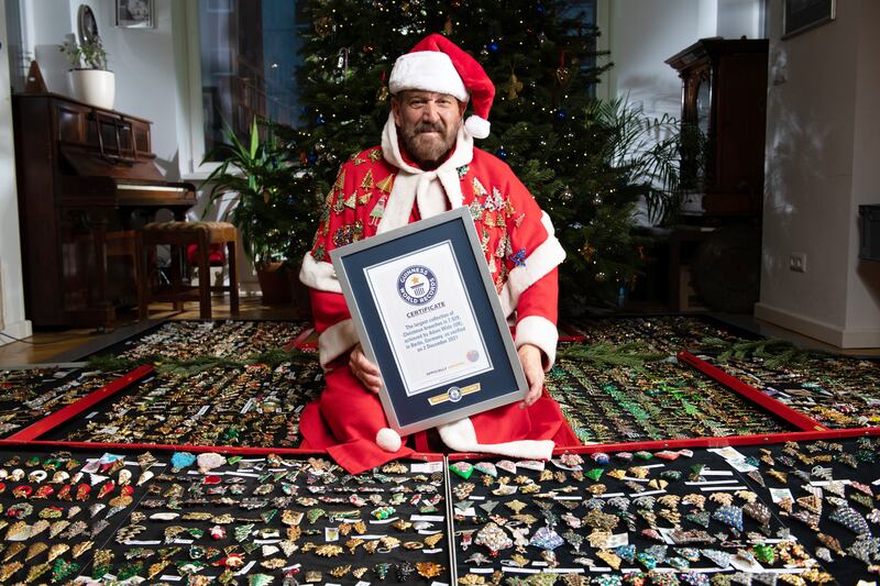 Adam Wide with 7,929 Christmas brooches. 