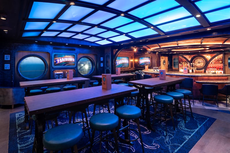 The interior of Periscope Pub with a curved glass ceiling that gives the impression of fish swimming overhead