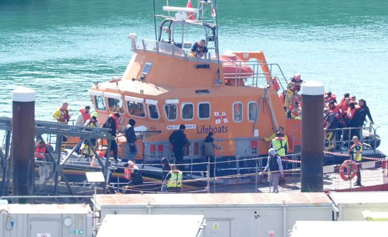 Groups of people were brought ashore in Dover, Kent, on Friday
