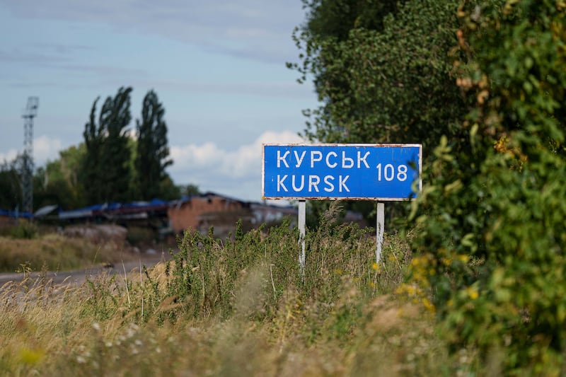 A sign that reads ‘Kursk 108 km’ is seen on the Russian-Ukrainian border in the Sumy region, Ukraine (Evgeniy Maloletka/AP)