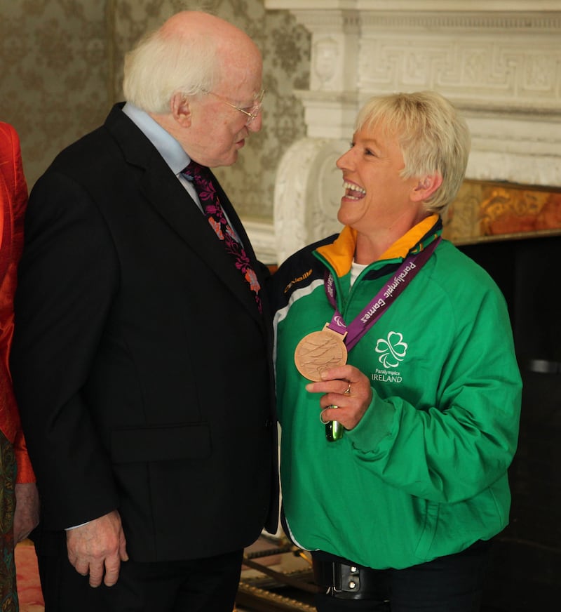 President Michael D Higgins meets equestrian bronze medalist Eilish Byrne during a reception for participants in the Paralympic Games at Aras an Uachtarain. 