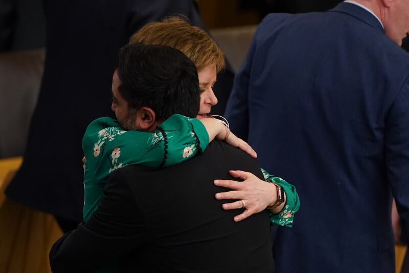 Mr Yousaf embraces Nicola Sturgeon after his final speech in Holyrood as first minister in May this year