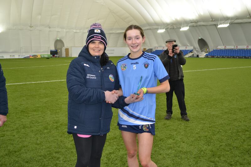 Martina Harkin presenting Player of the match to Aoibh Shivers.
