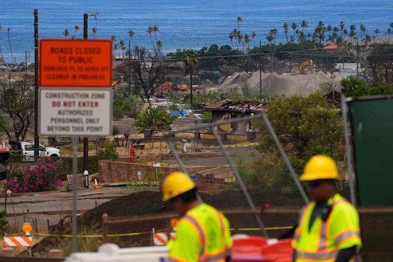 Crews work to clean debris and repave roads, on Saturday, July 6, 2024, in Lahaina, Hawaii (Lindsey Wasson/AP)