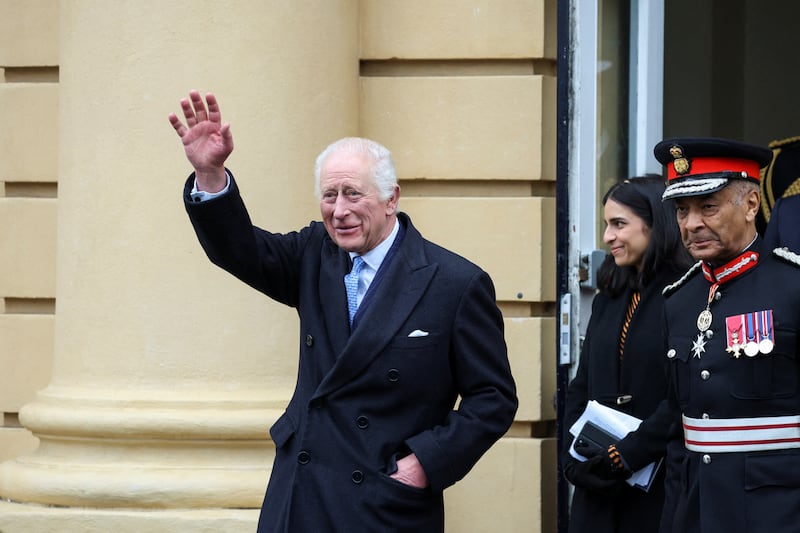 Charles waved to well-wishers before going on an impromptu walkabout