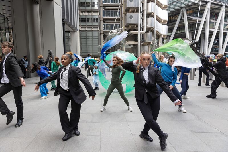 Mothers Rise Up – a group of concerned mums who campaign for climate action –staged a street performance outside Lloyd’s of London on Monday (Anna Gordon/Mothers Rise Up)