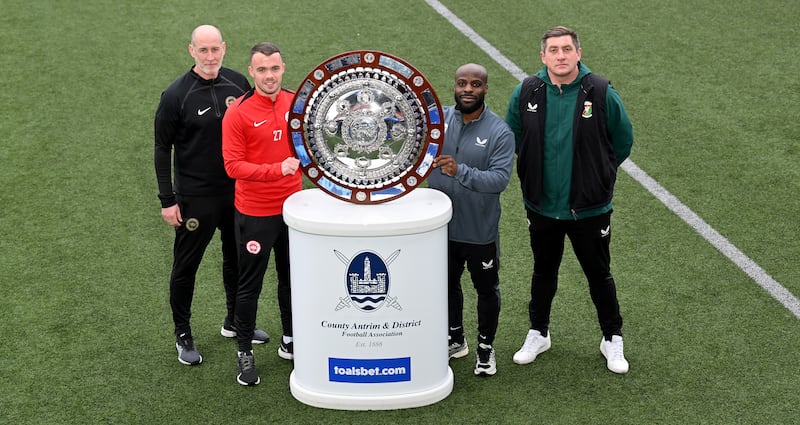 Larne manager Gary Haveron and midfielder Chris Gallagher pictured  with Glentoran’s Fuad Sule and manager Declan Devine at the launch of this year's Toals County Antrim Shield final