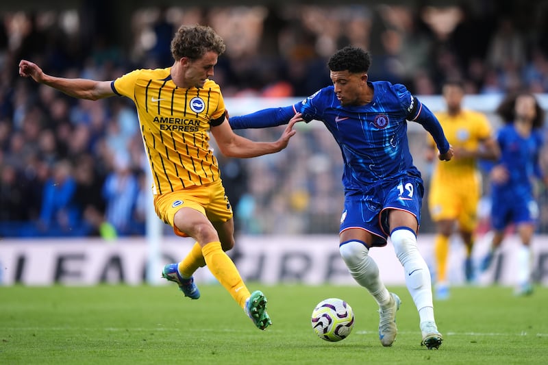 Jadon Sancho (right) was influential against Brighton .