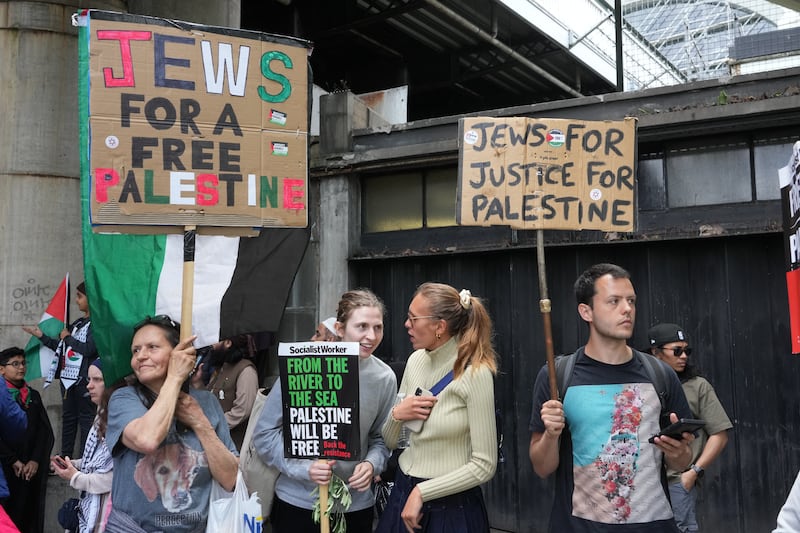 People hold up placards