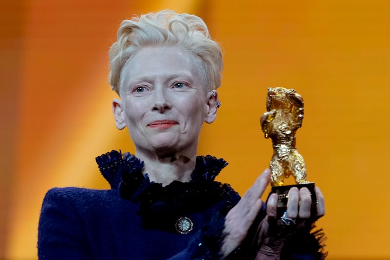 Tilda Swinton holds the honorary Golden Bear for her life’s work at the opening of the Berlin International Film Festival (Markus Schreiber/AP)