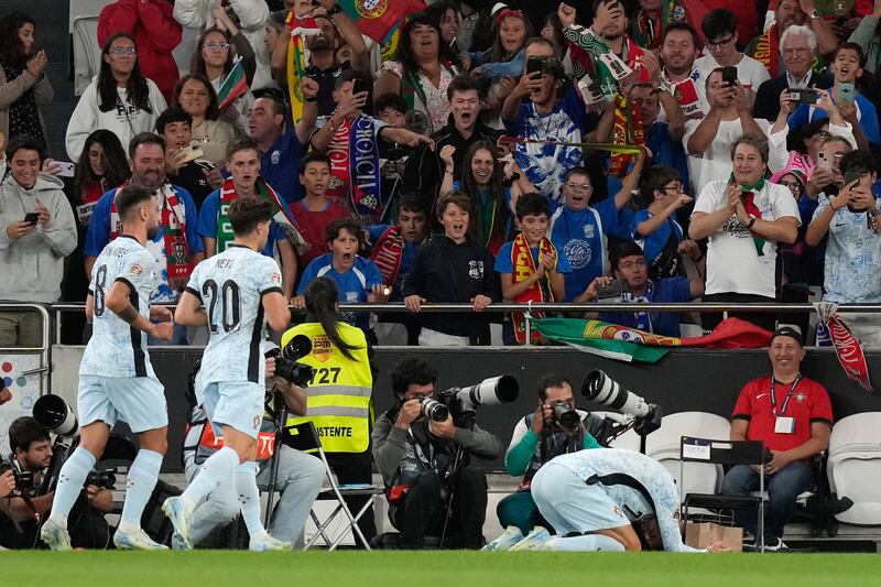 Cristiano Ronaldo collapsed to the ground after scoring for the 900th time (Armando Franca/AP)