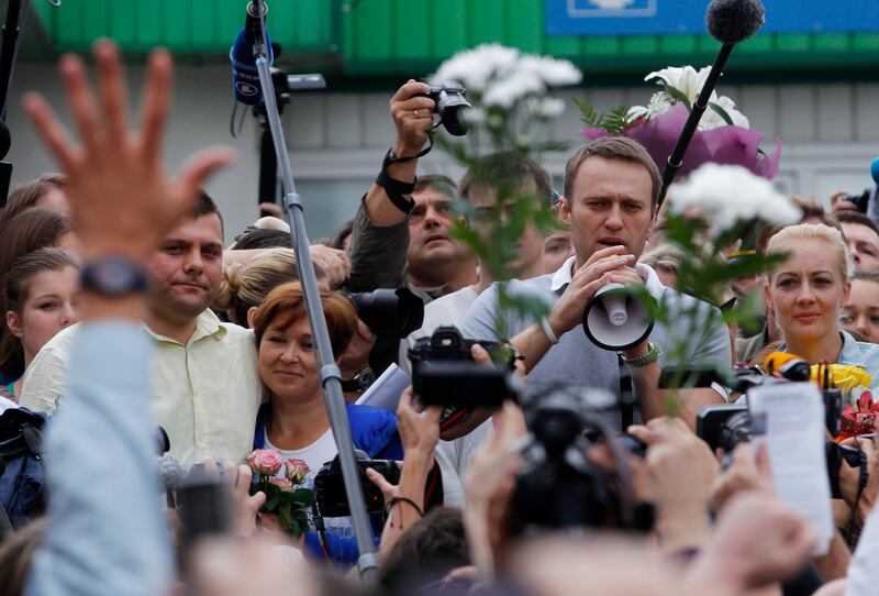 Opposition leader Alexei Navalny addresses supporters and journalists as part of a protest in Moscow in 2013 (AP Photo/Dmitry Lovetsky, File)