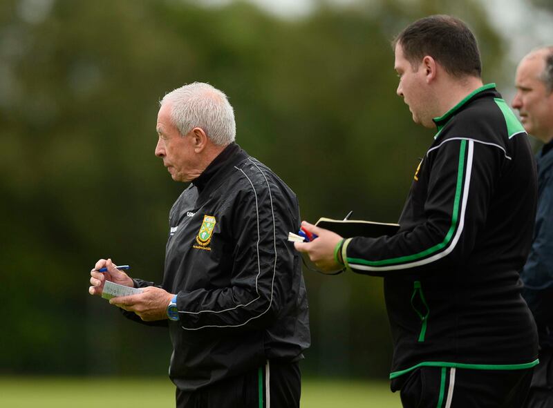 Aghagallon manager Pete McGrath takes notes against St Gall's.