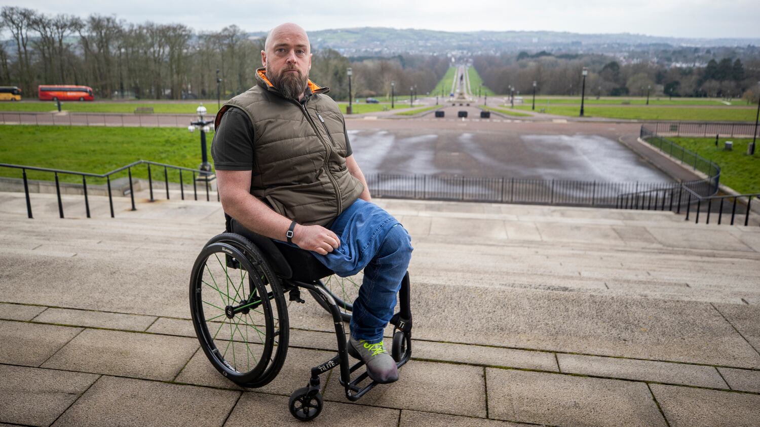Peader Heffron sitting in a wheelchair outside Stormont