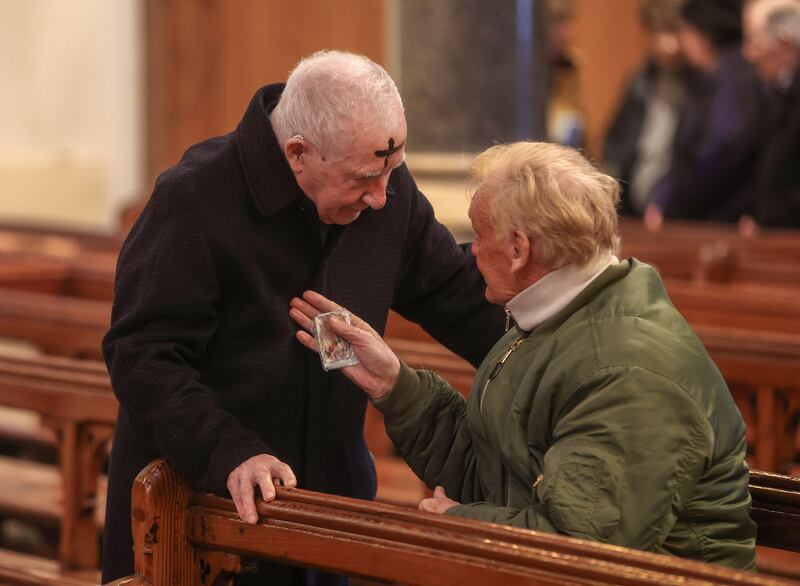 Parishioners young and old receive their ashes from Fr Tony and Fr Eugene at St Patricks Church in Donegall Street, Belfast marking the beginning of Lent