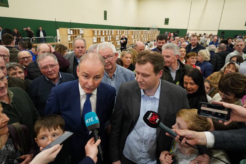 Fianna Fail party leader Micheal Martin, stands with Padraig O’Sullivan