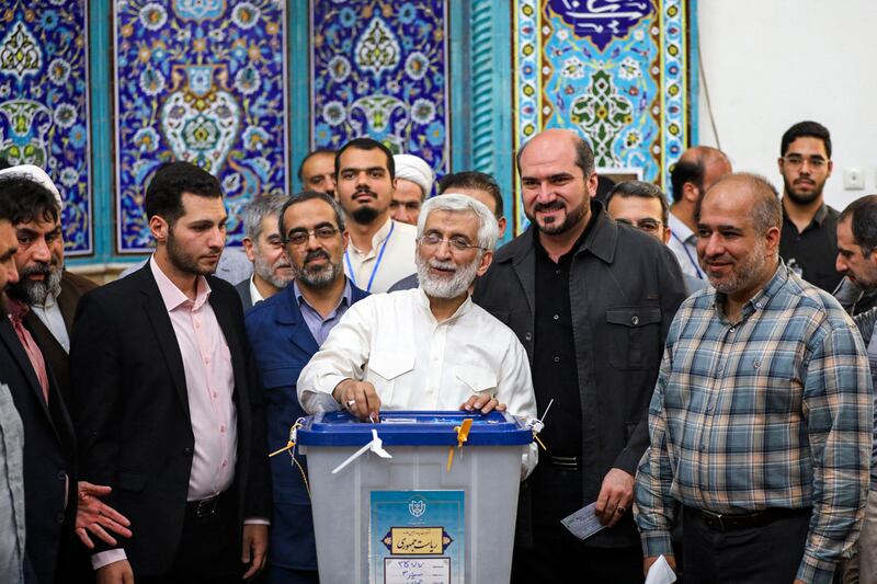 Saeed Jalili casts his ballot at a polling station in Tehran, Iran (Alireza Sotakabr, ISNA via AP)