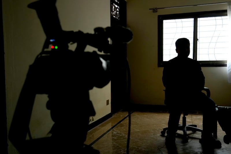 An Afghan refugee man, who asked not to show his face fearing his identity could lead to his capture, speaks during an interview in Islamabad (Anjum Naveed/AP)