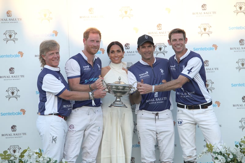 Meghan and Harry on the podium