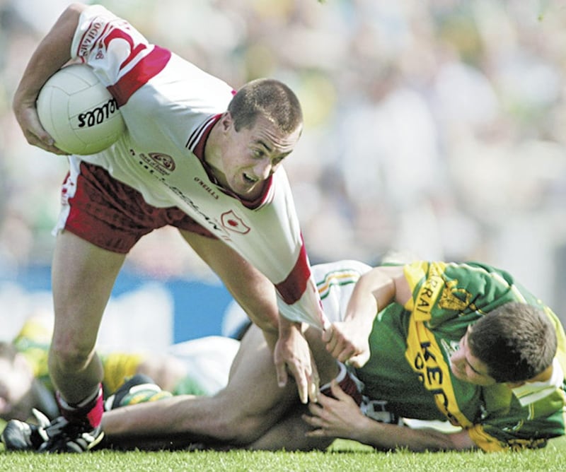 Kerry&#39;s Eamonn Fitzmaurice tries to get to grips with Tyrone&#39;s Brian McGuigan during the 2003 All-Ireland semi-final at Croke Park Picture Ann McManus 