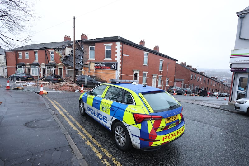 A police car at the scene of the gas explosion at a home in Blackburn