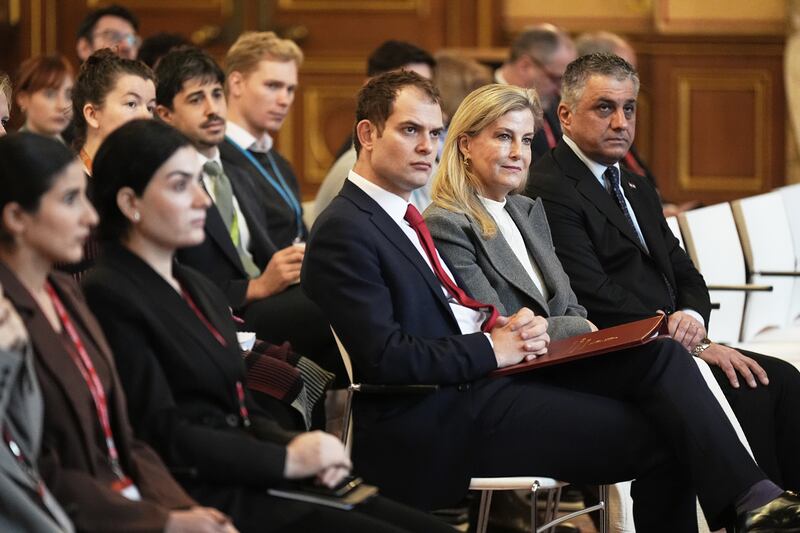 Foreign Office minister Hamish Falconer and the Duchess of Edinburgh listen during the engagement