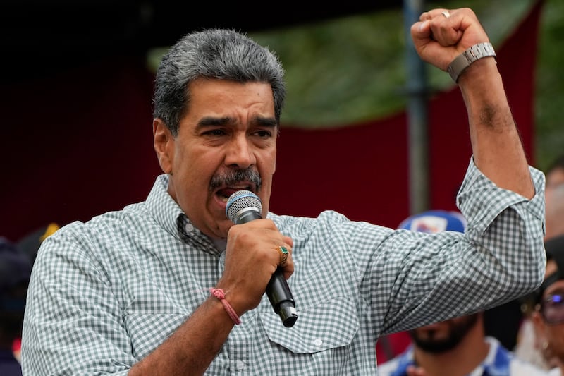 Venezuela’s President Nicolas Maduro addresses government loyalists gathered at the presidential palace in support of (Ariana Cubillos/AP)